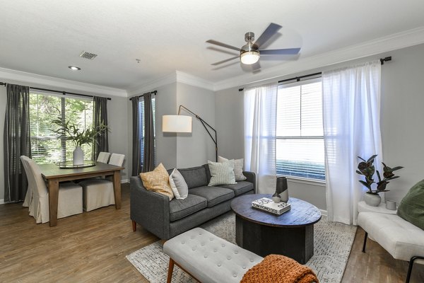 Living room with modern furnishings and natural light in Avana Ridenour Apartments