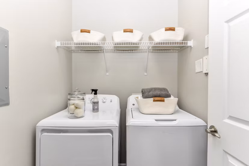 Laundry room featuring modern appliances at Avana Ridenour Apartments