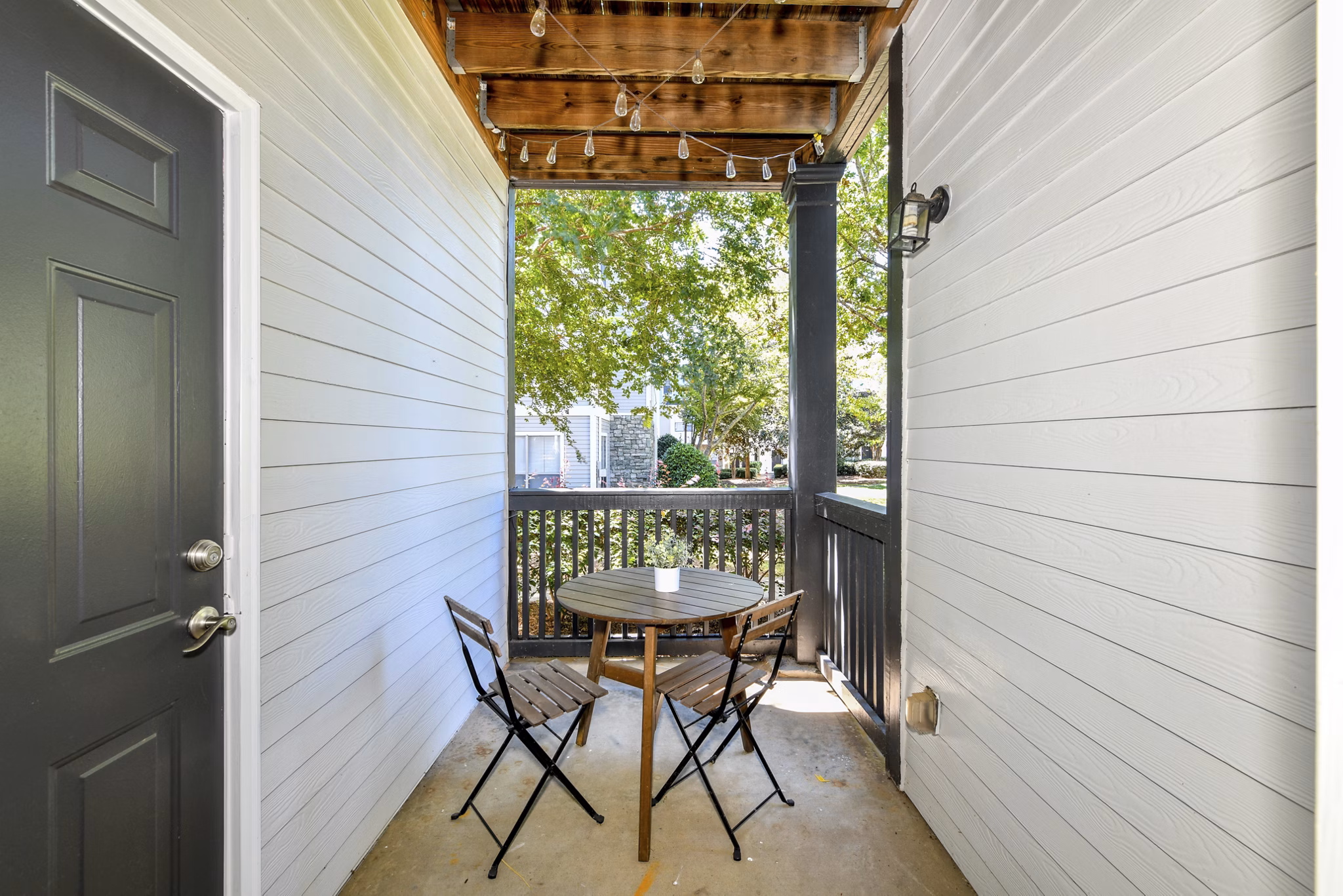 Patio with stylish outdoor seating at Avana Ridenour Apartments, ideal for relaxation
