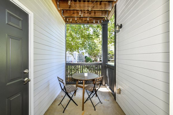 Patio with stylish outdoor seating at Avana Ridenour Apartments, ideal for relaxation