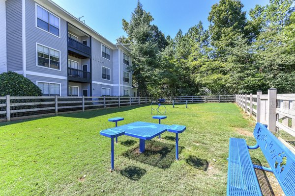 Dog-friendly space with agility course at Avana Ridenour Apartments' dog park