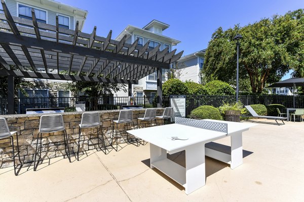 Courtyard with lush greenery and seating areas at Avana Ridenour Apartments