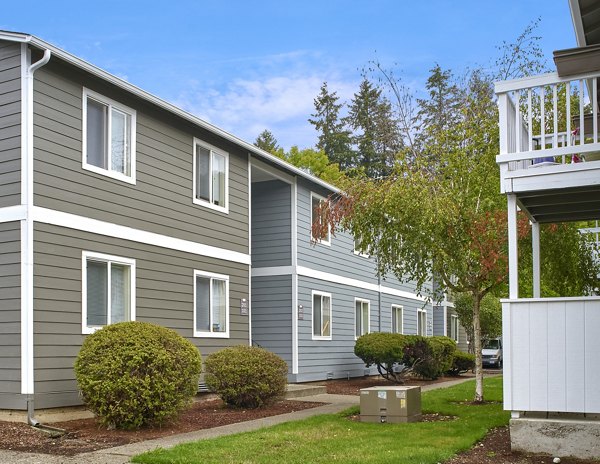 Irwin Park Apartments: Luxurious view of upscale apartment complex in serene green surroundings