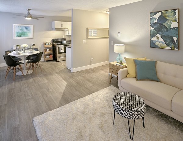 Cozy living room with natural light at Irwin Park Apartments, Greystar luxury living in a serene setting