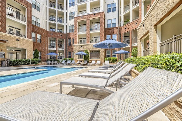 Modern pool with sun deck at Elan City Center luxury apartments in downtown