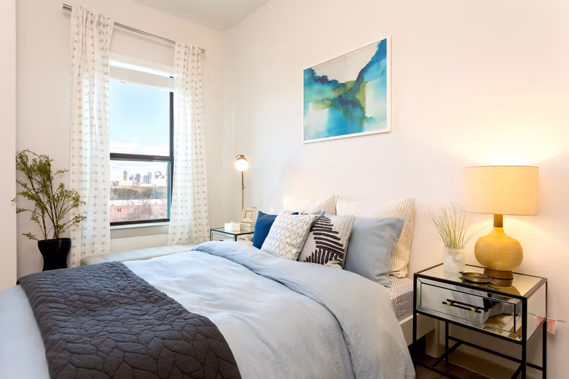 Modern bedroom with lake views at Azul Lakeshore Apartments, luxury living by Greystar