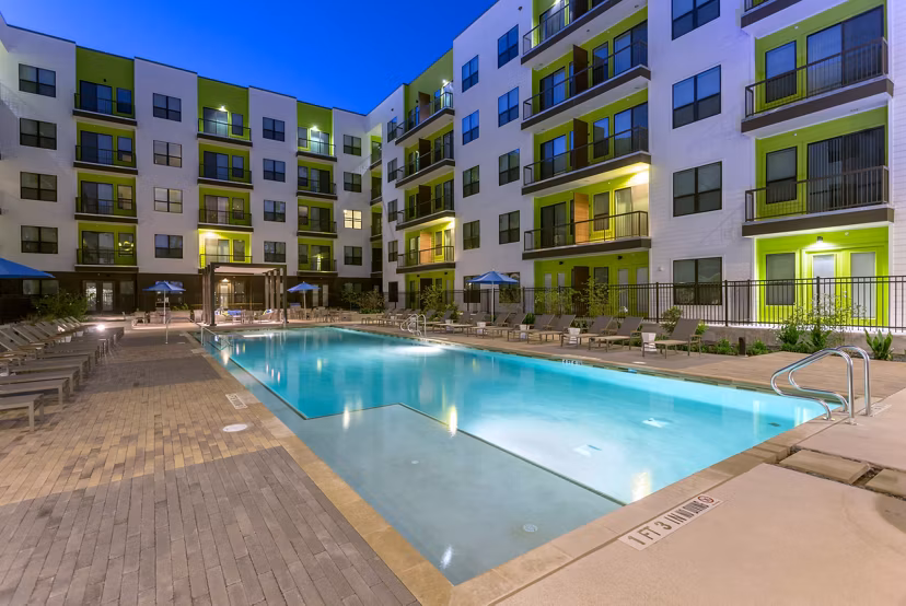 Resort-style pool with lounge chairs at Azul Lakeshore Apartments, perfect for relaxation