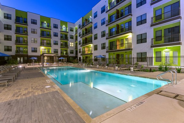 Resort-style pool with lounge chairs at Azul Lakeshore Apartments, perfect for relaxation