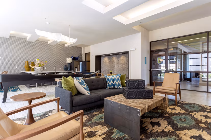 Clubhouse with modern design and seating areas at Azul Lakeshore Apartments offering luxury living by the lake