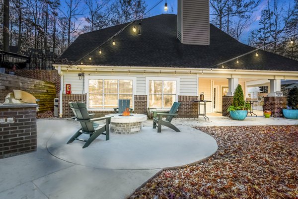 Patio with cozy fire pit at Harvest Apartments, offering luxury outdoor relaxation spaces