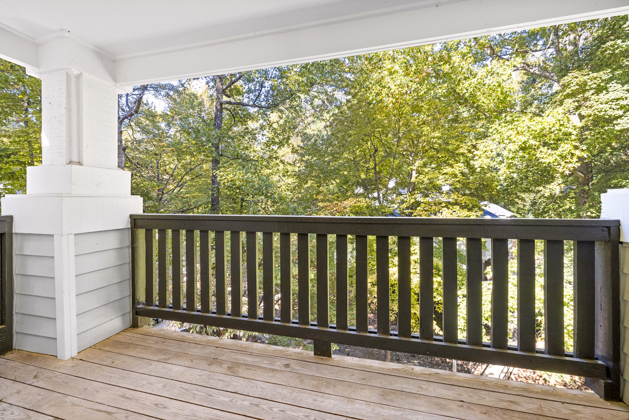 Spacious outdoor patio with seating area at Harvest Apartments, ideal for relaxation and socializing in a luxury community environment