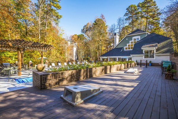 Spacious recreational area with modern seating and greenery at Harvest Apartments, offering luxury living experiences in a vibrant community