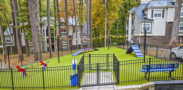Modern dog park with agility equipment at Harvest Apartments, offering a pet-friendly environment for residents to enjoy with their furry friends