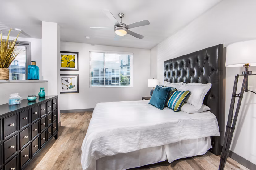 Modern bedroom with minimalist design and ample natural light at Access Culver City Apartments Perfect for comfort and style in a luxury setting