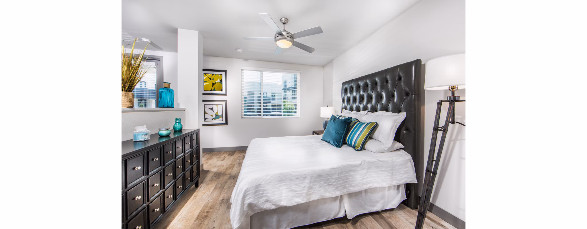 Modern bedroom with minimalist design and ample natural light at Access Culver City Apartments Perfect for comfort and style in a luxury setting