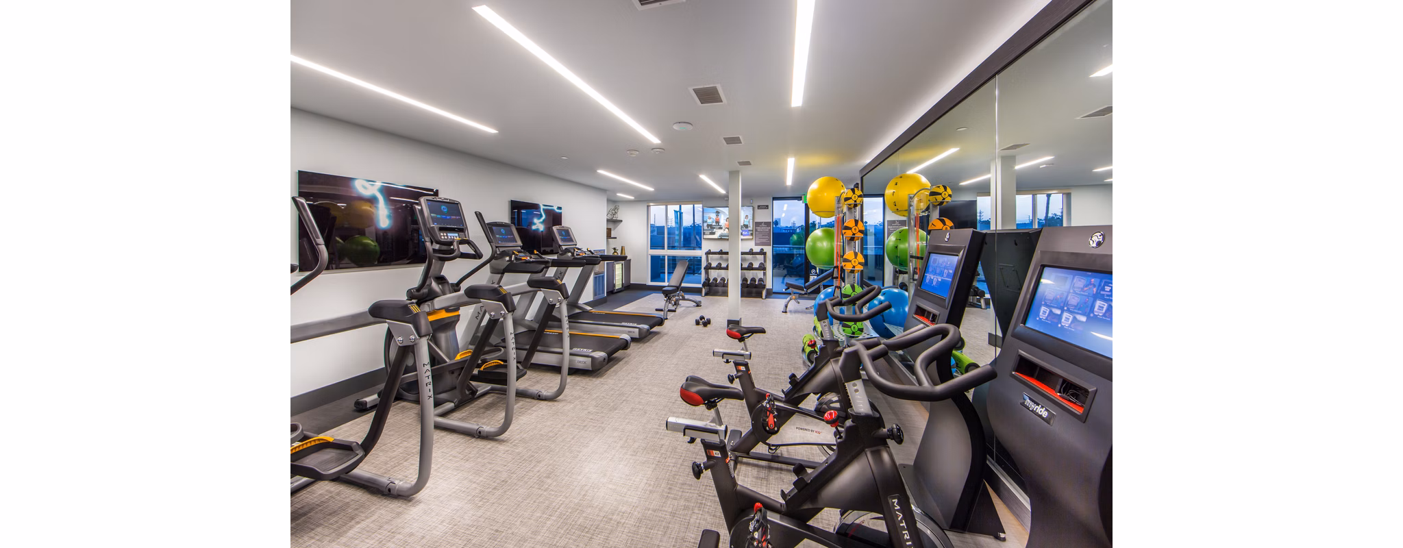 Modern fitness center with state-of-the-art equipment at Access Culver City Apartments