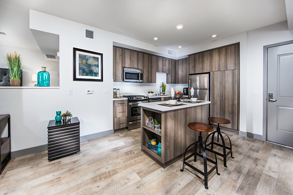 Modern kitchen with stainless steel appliances at Access Culver City Apartments