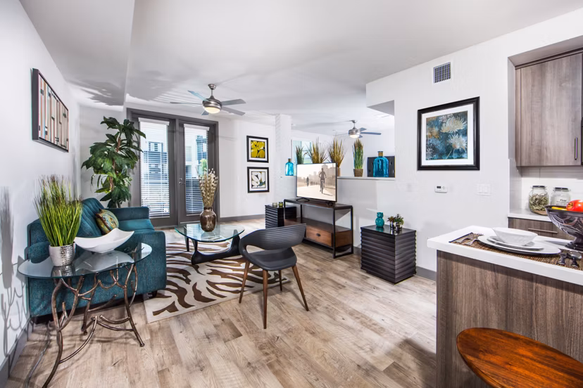 Spacious living room with modern decor and natural light in Access Culver City Apartments