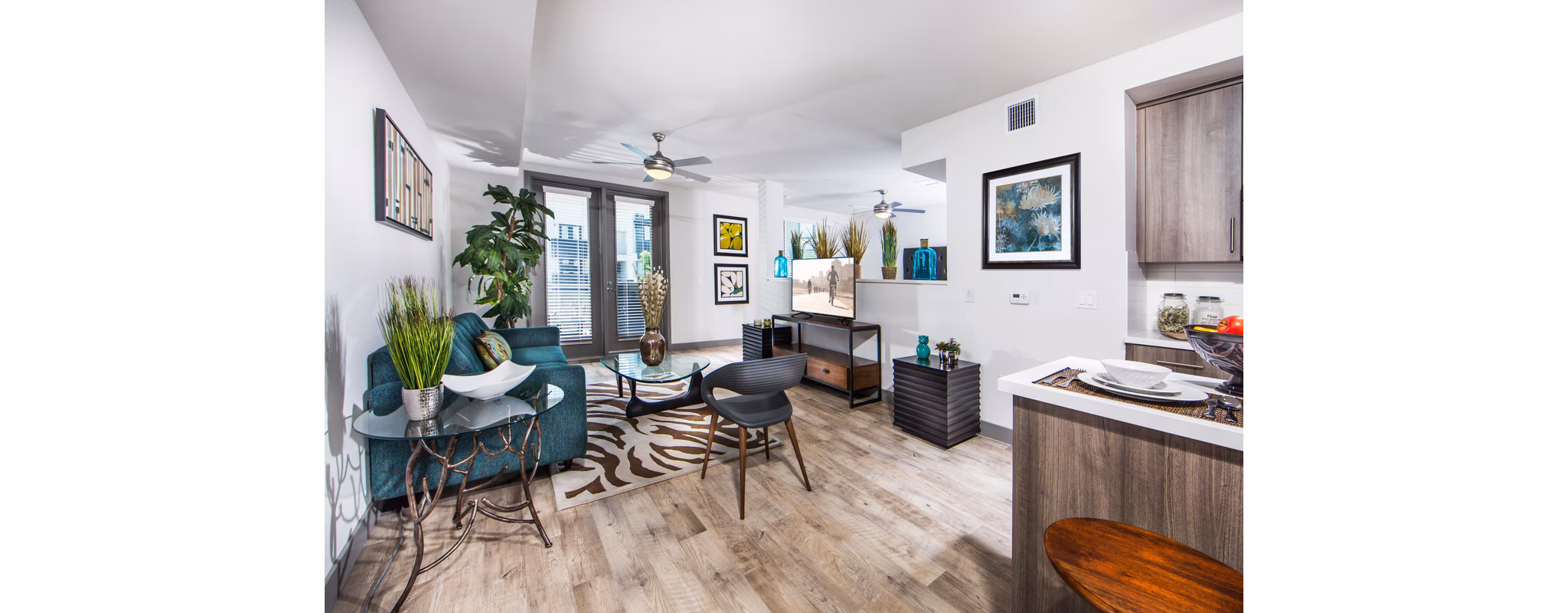 Spacious living room with modern decor and natural light in Access Culver City Apartments