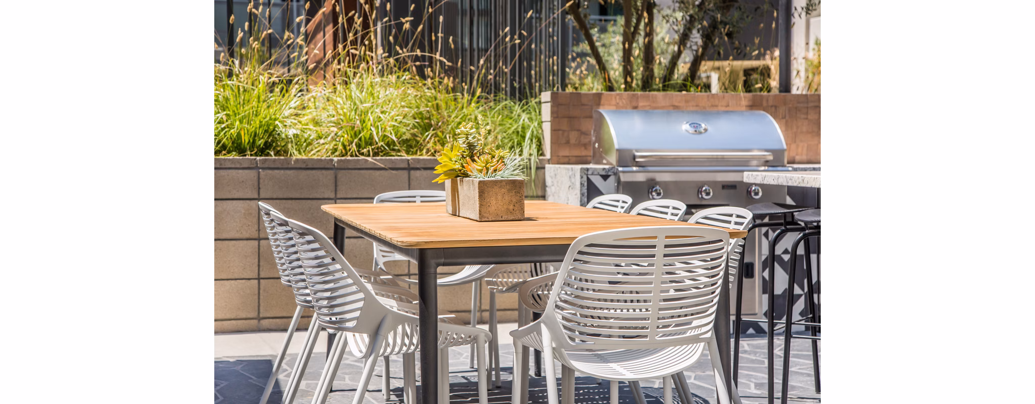 Patio with contemporary seating at Access Culver City Apartments featuring comfortable lounge space suitable for relaxation and social gatherings