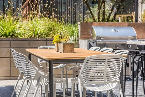 Patio with contemporary seating at Access Culver City Apartments featuring comfortable lounge space suitable for relaxation and social gatherings