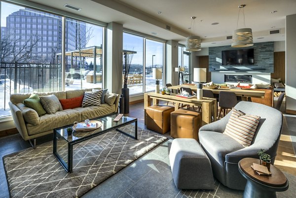 Clubhouse lobby with elegant design and modern furnishings at The Island Residences at Carlson Center Apartments