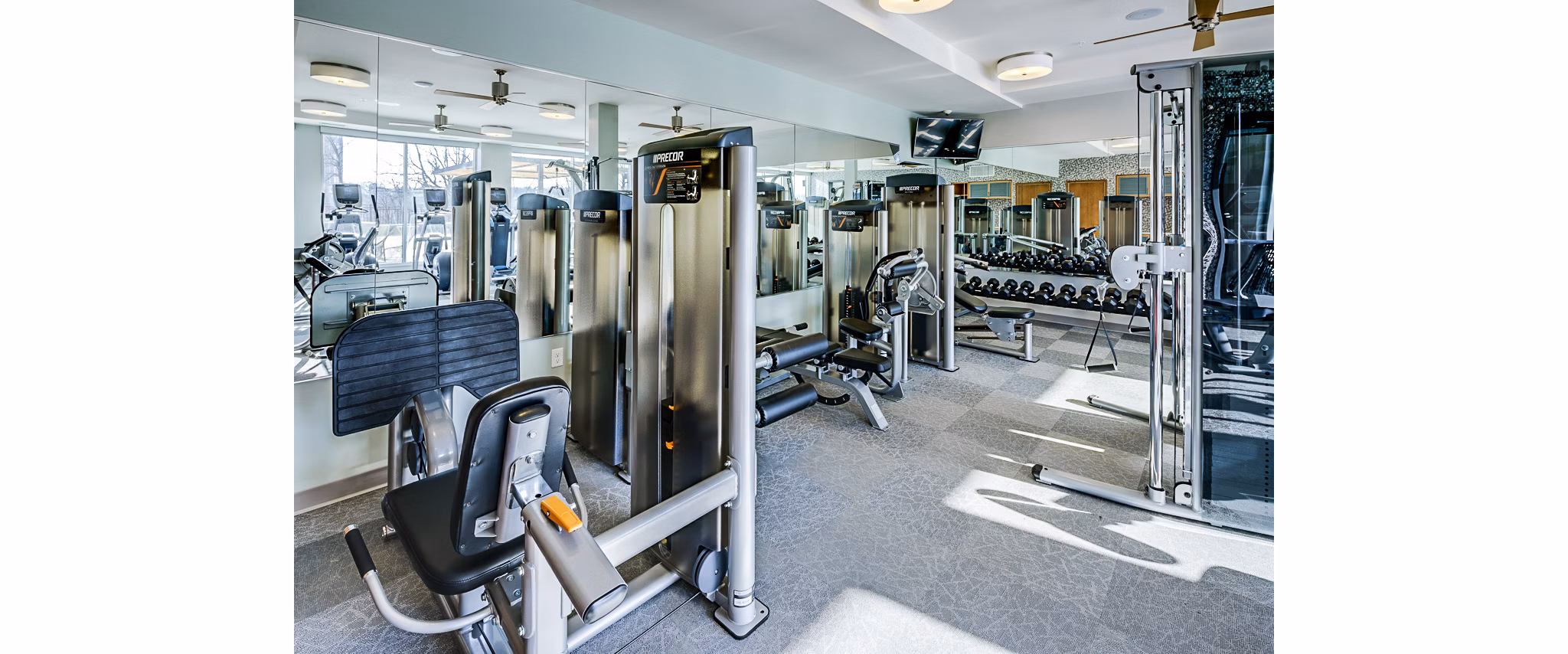 State-of-the-art fitness center with modern equipment at The Island Residences at Carlson Center Apartments