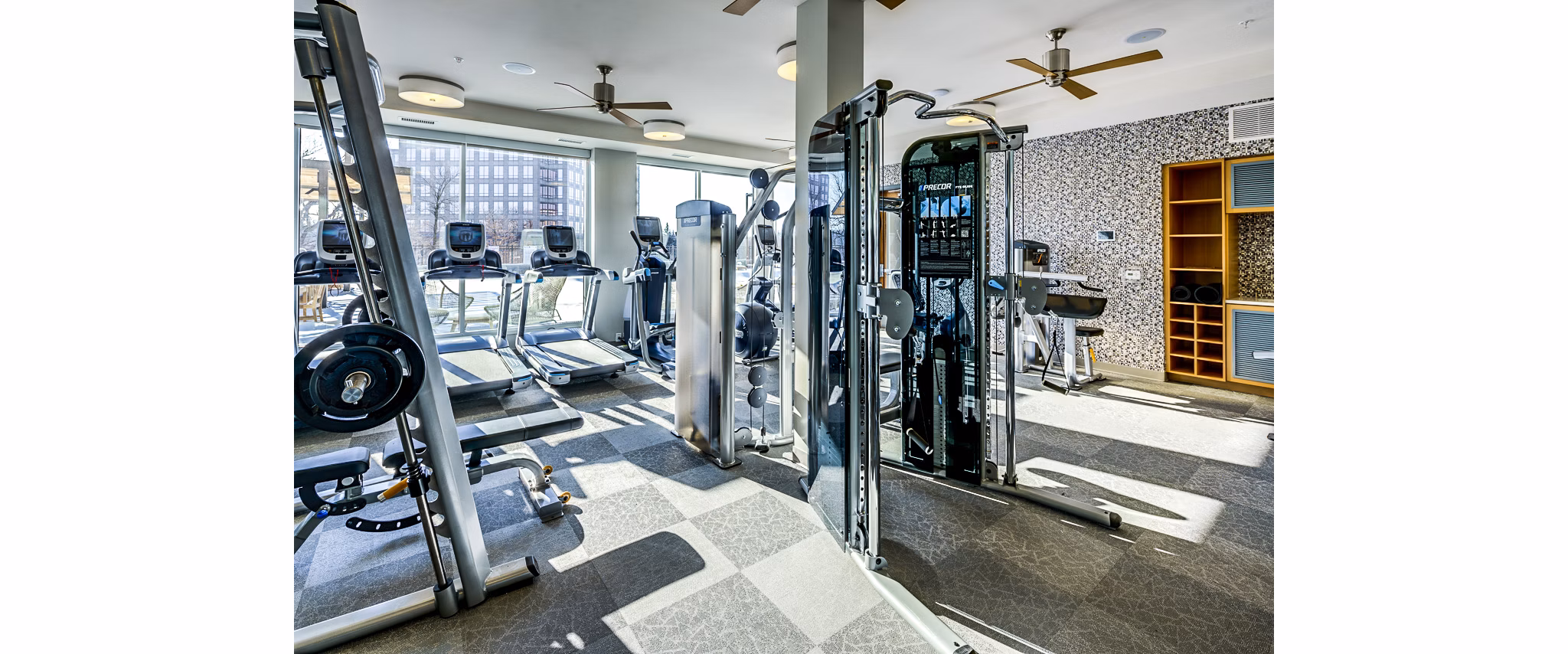 State-of-the-art fitness center with modern equipment at The Island Residences at Carlson Center Apartments