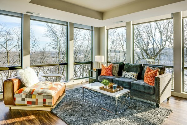 Spacious living room with modern furnishings at The Island Residences at Carlson Center Apartments