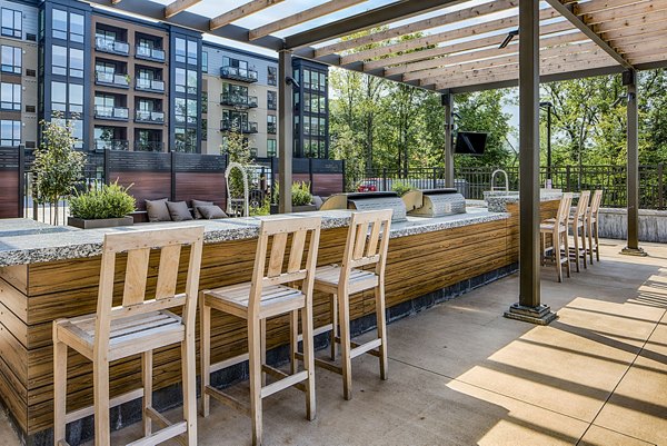 Spacious patio with BBQ grill area at The Island Residences at Carlson Center luxury apartments