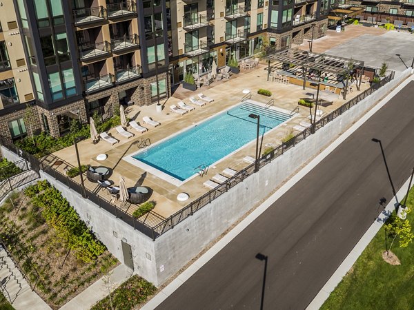 Modern pool lounge at The Island Residences at Carlson Center offering relaxation and leisure for luxury apartment residents