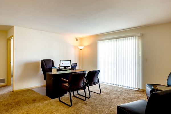 Welcoming living room with cozy furniture and natural light at Eagles Landing Apartments