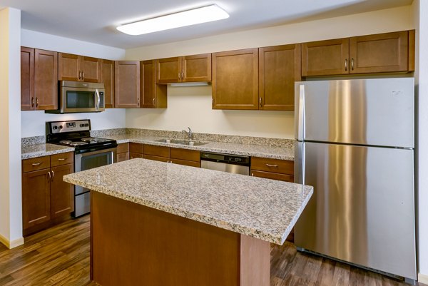 Eagles Landing Apartments: Modern kitchen with stainless steel appliances and granite countertops