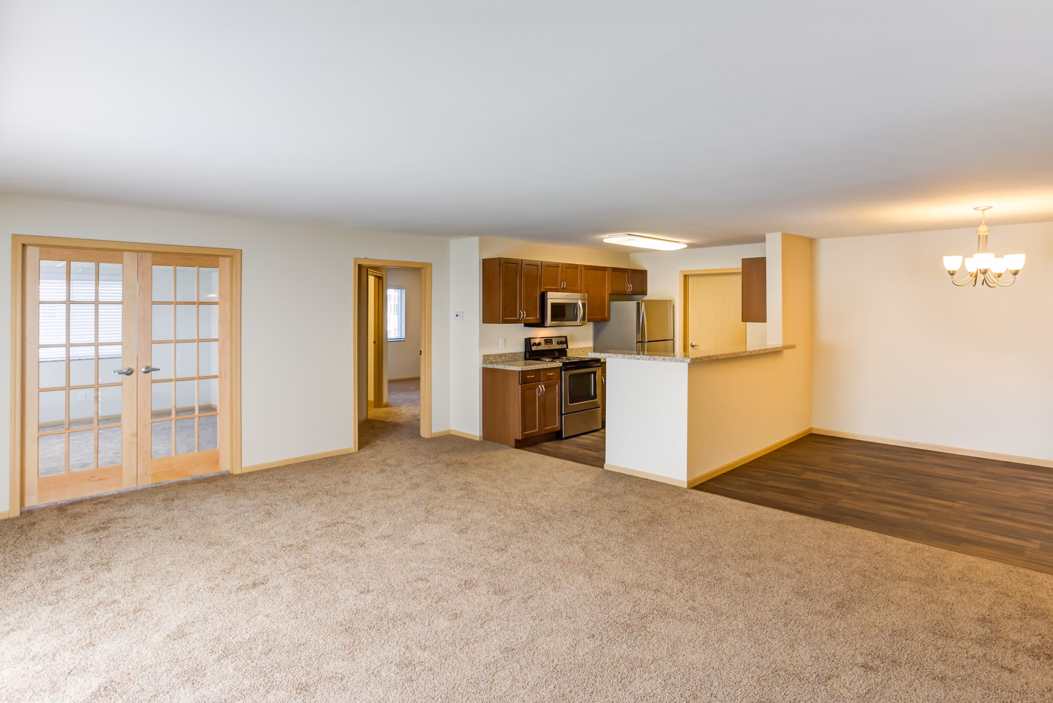 Modern living room with sleek furniture at Eagles Landing Apartments, showcasing luxury apartment interiors