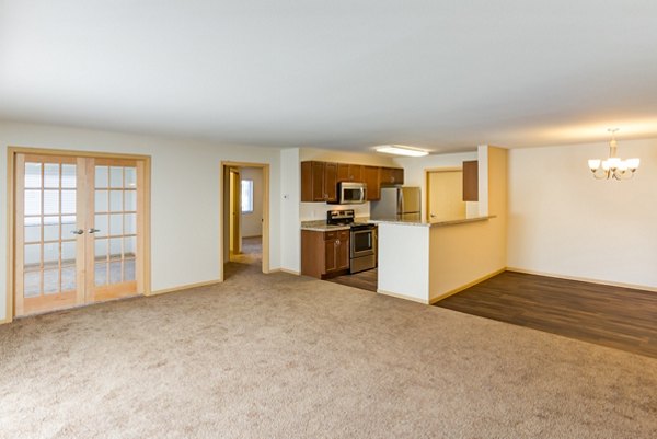 Modern living room with sleek furniture at Eagles Landing Apartments, showcasing luxury apartment interiors