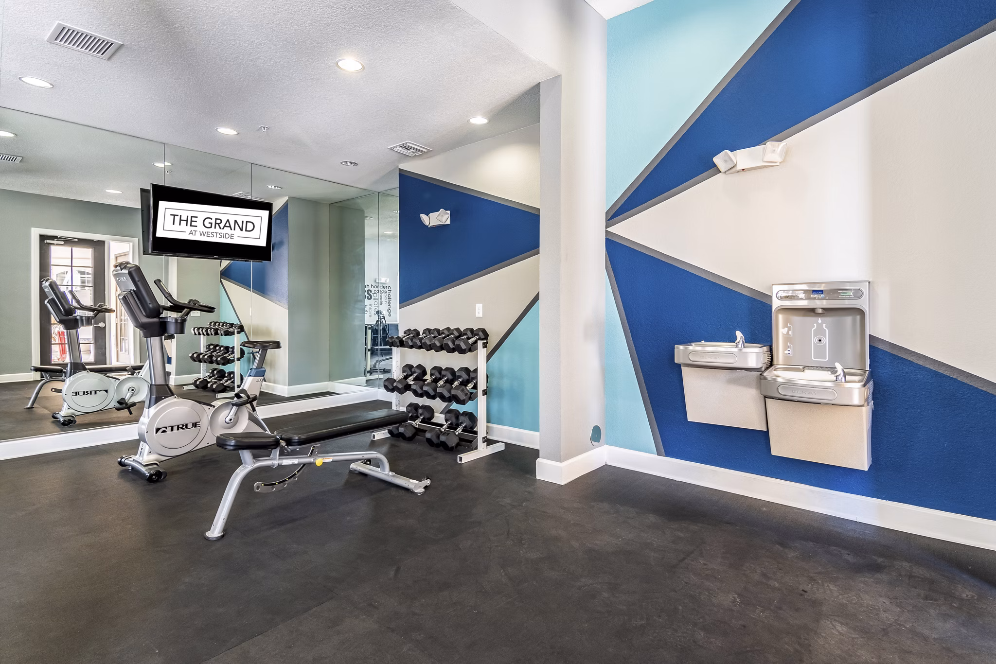 fitness center at The Grand at Westside Apartments 