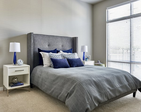 Spacious bedroom with modern design elements by Tim Schelfe at Solis 9th Street apartments
