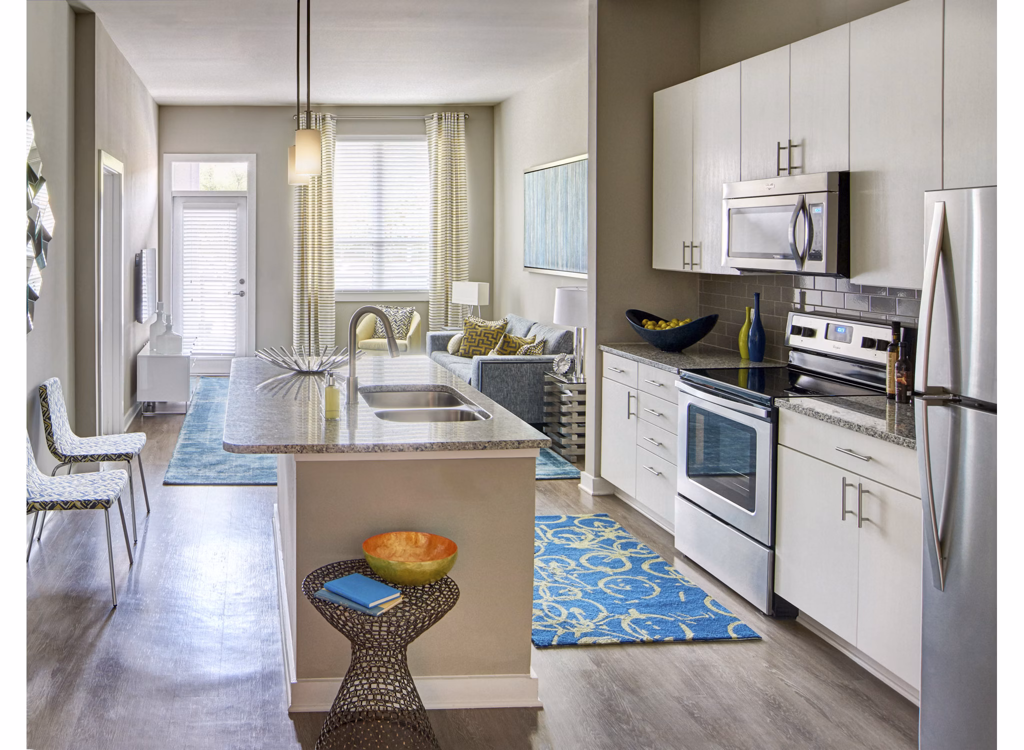 Modern kitchen with sleek cabinetry and stainless steel appliances in Solis 9th Street, designed by Tim Schelfe, JDavis Architects