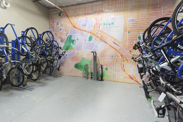Bike storage room with ample racks at 810 NINTH Apartments, ideal for cyclists seeking secure and convenient bike parking
