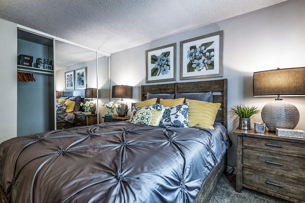 The Alden Apartments: Stylish bedroom with modern decor and large windows