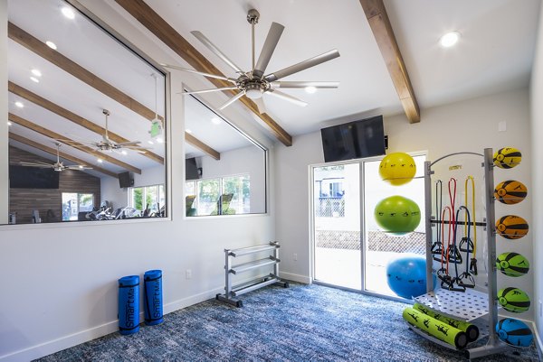 State-of-the-art fitness center with modern equipment at The Alden Apartments, offering a premium workout experience for residents