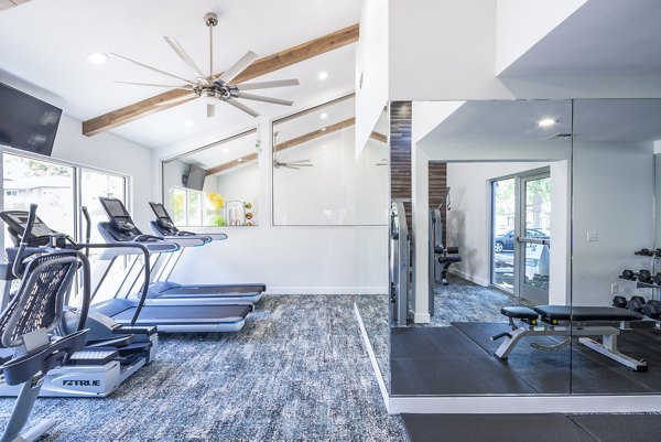 Modern fitness center with state-of-the-art equipment at The Alden Apartments