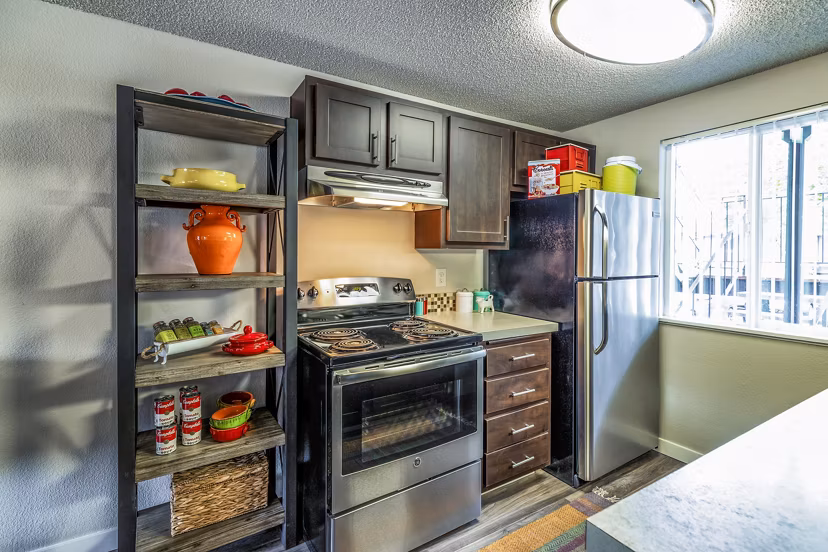 Modern kitchen with stainless steel appliances at The Alden Apartments, a luxury living option within the Greystar community