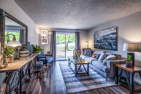 Spacious living room with modern design elements at The Alden Apartments
