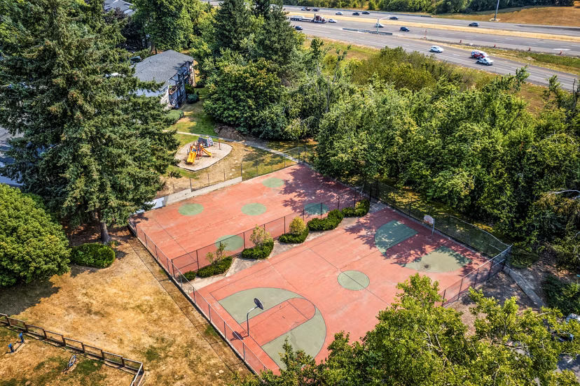 Sport courts at The Alden Apartments offering tennis and basketball facilities for residents in a vibrant community setting