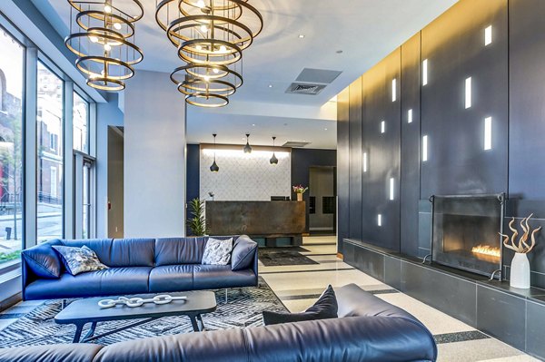 A stylish clubhouse lobby with modern decor at 2116 Chestnut Apartments