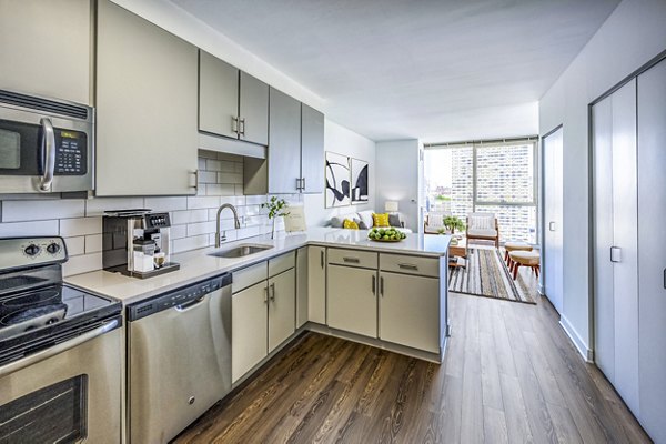 Modern kitchen with stainless steel appliances at 2116 Chestnut Apartments Greystar luxury apartments offer sleek, functional design