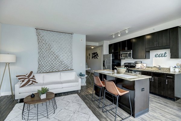 Kitchen featuring modern appliances and granite countertops at 2116 Chestnut Apartments