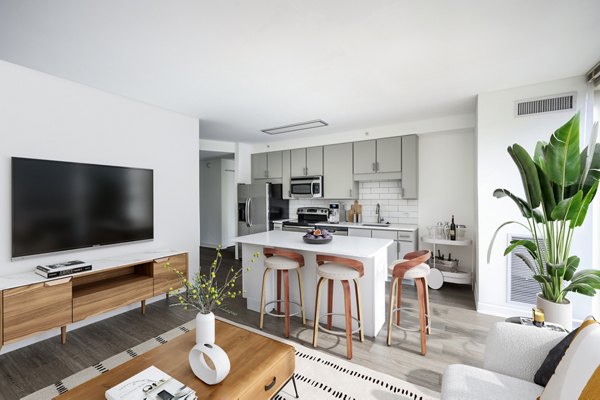 Spacious living room with modern decor at 2116 Chestnut Apartments, luxury rentals by Greystar in a vibrant location