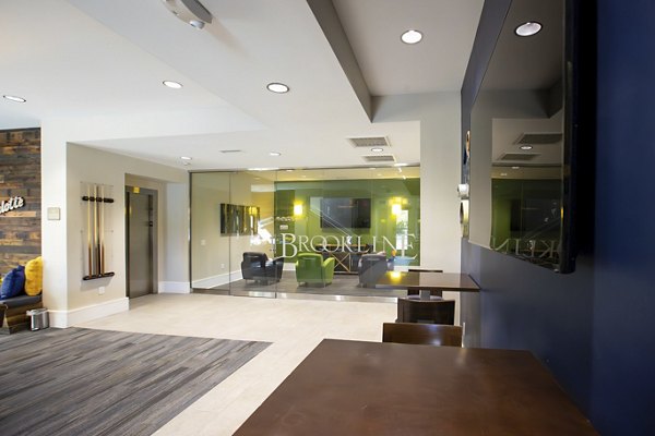 Modern clubhouse featuring elegant decor and seating at Residences at Brookline Apartments